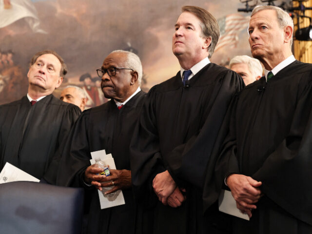 Supreme Court Members Alito, Thomas, Kavanaugh, Roberts From L-R) US Associate Supreme Court Justices Samuel Alito, Jr., Clarence Thomas and Brett