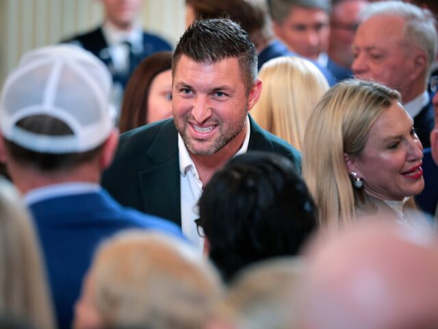 tim tebow is prasied WASHINGTON, DC - MAY 21: Former football quarterback Tim Tebow joins guests during a celeb