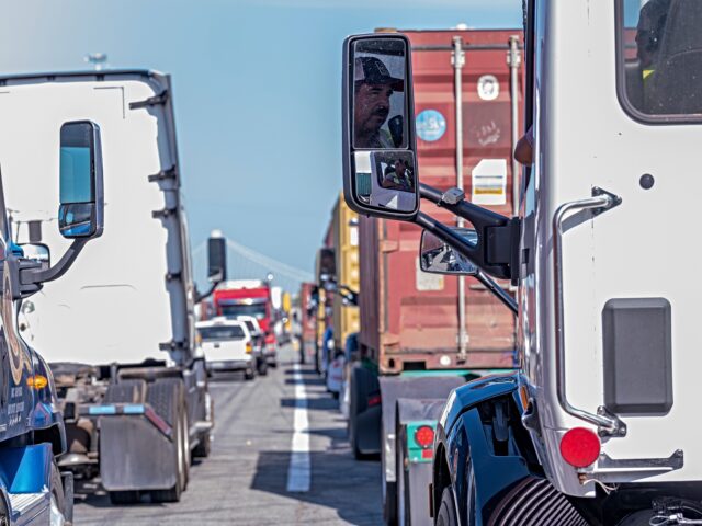 truck drivers Trucks at the entrance at the Port of Oakland during a protest in Oakland, California, US,