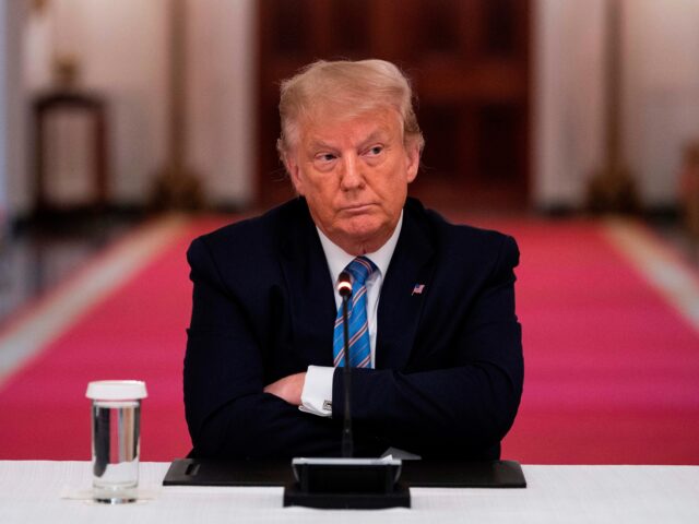 trump nato OPSHOT - US President Donald Trump sits with his arms crossed during a roundtable discussi