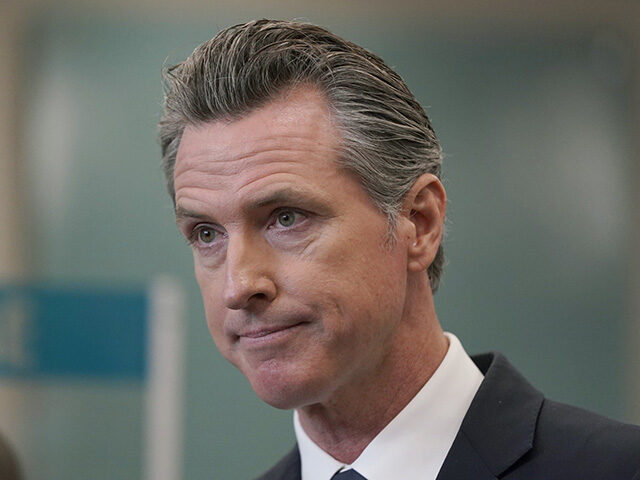 In this July 26, 2021, file photo, California Gov. Gavin Newsom appears at a news conference in Oakland, Calif. The Orange County Board of Education in Southern California announced plans to sue Newsom over a state mandate requiring K-12 students to wear masks in classrooms. (AP Photo/Jeff Chiu, File) Biden - In this July 26, 2021, file photo, California Gov. Gavin Newsom appears at a news