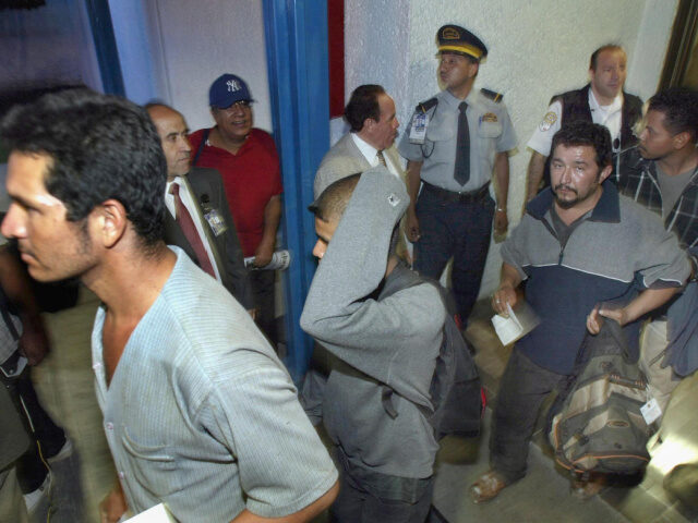 Voluntary, Self-Deportations to Mexico A group of migrants deported by the United States leave 12 July, 2004 Mexico City's i
