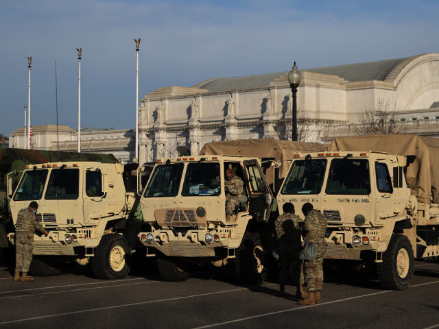 2000 National Guard Troops Deploy to Los Angeles (1) National Guard trucks are parked in a lot in between the U.S. Capitol and Union Station on