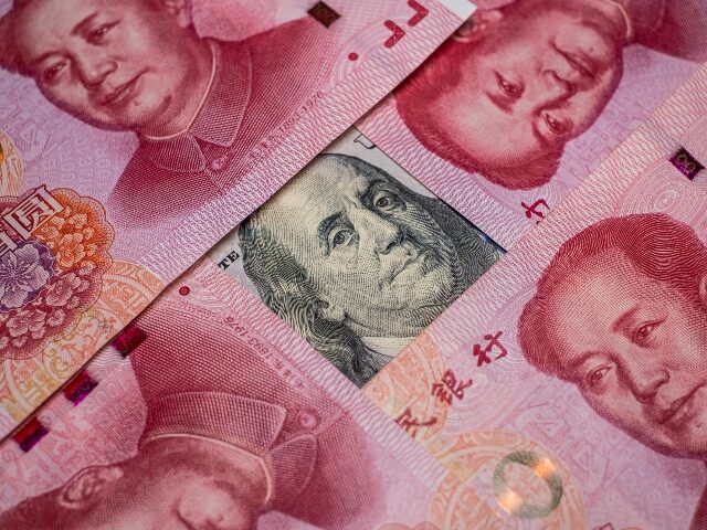 a-hundred-dollar-bill-covered-by-chinese-rmb-640x480-1 A hundred dollar bill covered by Chinese RMB