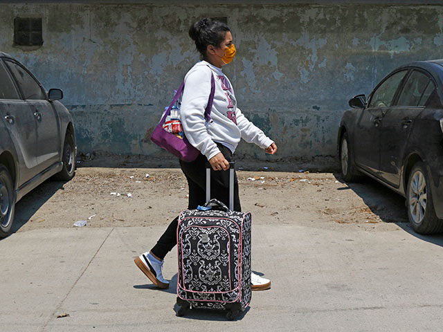 ap25140005795702-640x480-1 A Honduran migrant who returned voluntarily from the United States walks after arriving at