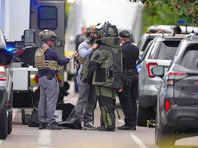 ap25152813149498-640x480-1 Law enforcement officials dress up in protective gear to investigative an attack on the Pe