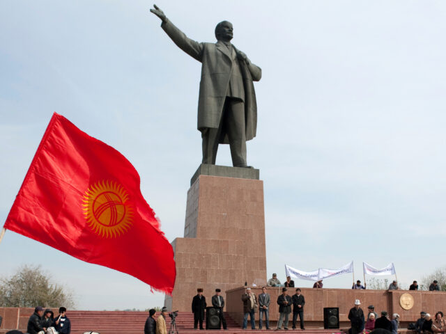 ap25159366112810-1-640x480-1 FILE - Protesters rally in front of a statue of Soviet Union founder Vladimir Lenin on a c