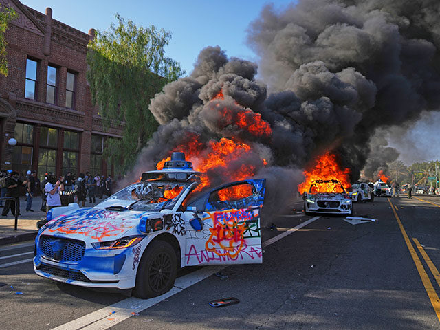 ap25160049859690-640x480-1 Multiple Waymo taxis burn near the Metropolitan Detention Center of downtown Los Angeles,