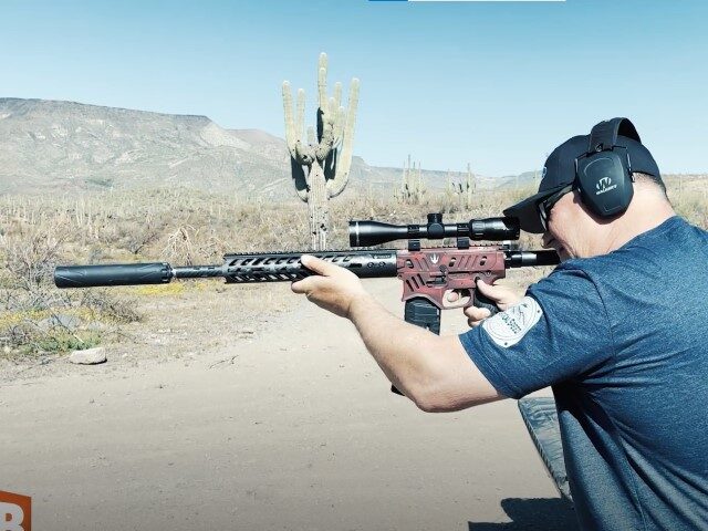 AWR Hawkins demonstrates shooting with a suppressor AWR Hawkins demonstrates shooting with a suppressor (screenshot AWR Hawkins/Breitbart News