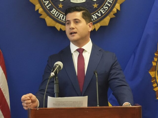 Bill Essayli (Damian Dovarganes / Associated Press) U.S. Attorney Bill Essayli, at podium with Akil Davis is the Assistant Director in Charge