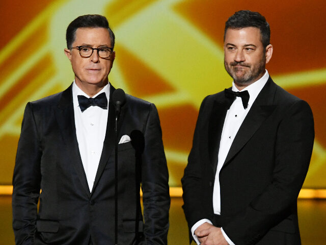 colbertkimmel LOS ANGELES, CALIFORNIA - SEPTEMBER 22: (L-R) Stephen Colbert and Jimmy Kimmel speak onsta