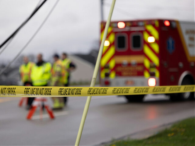 crime-scene-firetruck-ambulance-accident-emergency-scene-benjamin-lehman-unsplash Emergency personnel behind “FIRE LINE DO NOT CROSS” tape near an ambulance.
