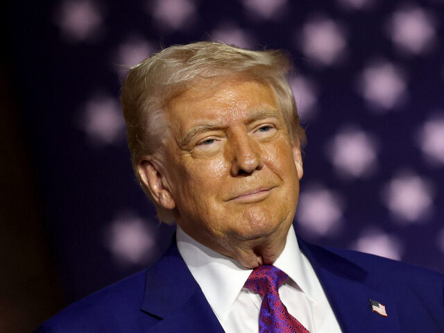 Donald Trump President Donald J. Trump stands on stage as he tours the Al Udeid Air Base on May 15, 202
