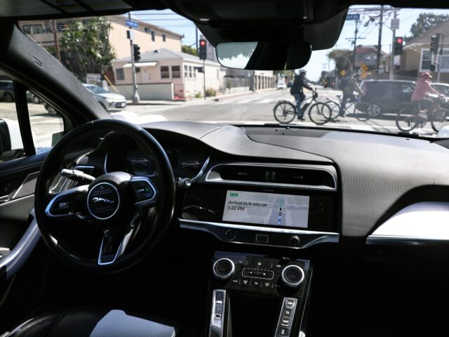 driverless car LOS ANGELES, CALIFORNIA - MARCH 14: A Waymo autonomous self-driving Jaguar taxi drives alo