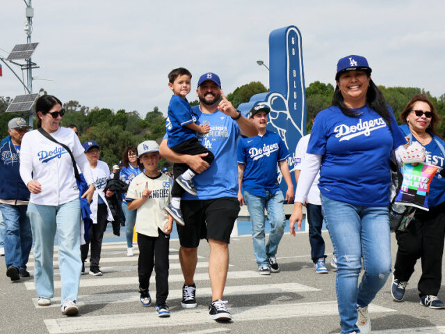 Fans in Dodger Stadium Parking Lot getty LOS ANGELES, CA - MARCH 27: Fans head to the gates in the parking lot of Dodger Stadium be