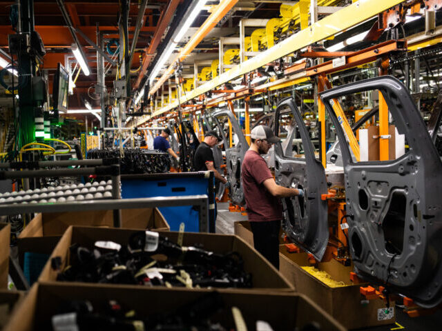 Inside A General Motors Assembly Plant Ahead Of Earnings Figures Workers assemble vehicle doors at the General Motors assembly plant in Fort Wayne, Indiana