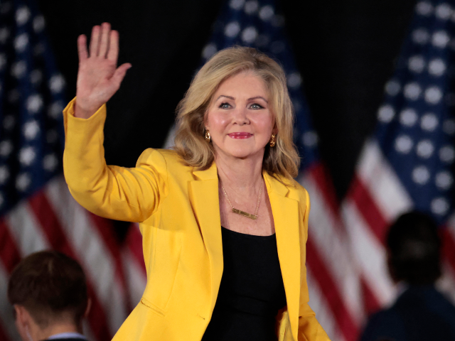 GettyImages-2174050419 US Sen. Marsha Blackburn (R-TN) waves as she arrives for a town hall with former US Presid