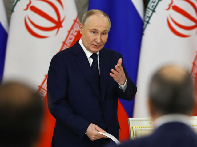 RUSSIA-IRAN-POLITICS-DIPLOMACY Russian President Vladimir Putin attends a documents signing ceremony with Iranian Preside