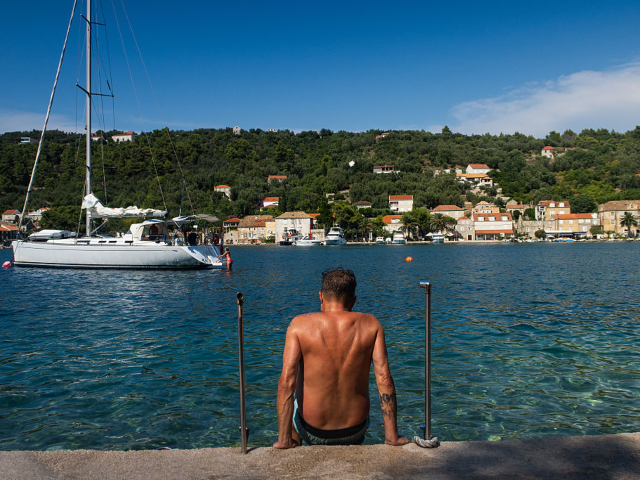 GettyImages-2209139611 DUBROVNIK, CROATIA - JULY17: A tanned man is seen getting into the water on ipan island, t