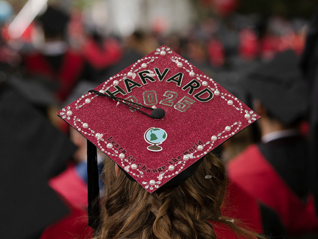 GettyImages-2216988003 CAMBRIDGE, MASSACHUSETTS - MAY 29: A graduate's cap reads "Learn to Change the World" duri