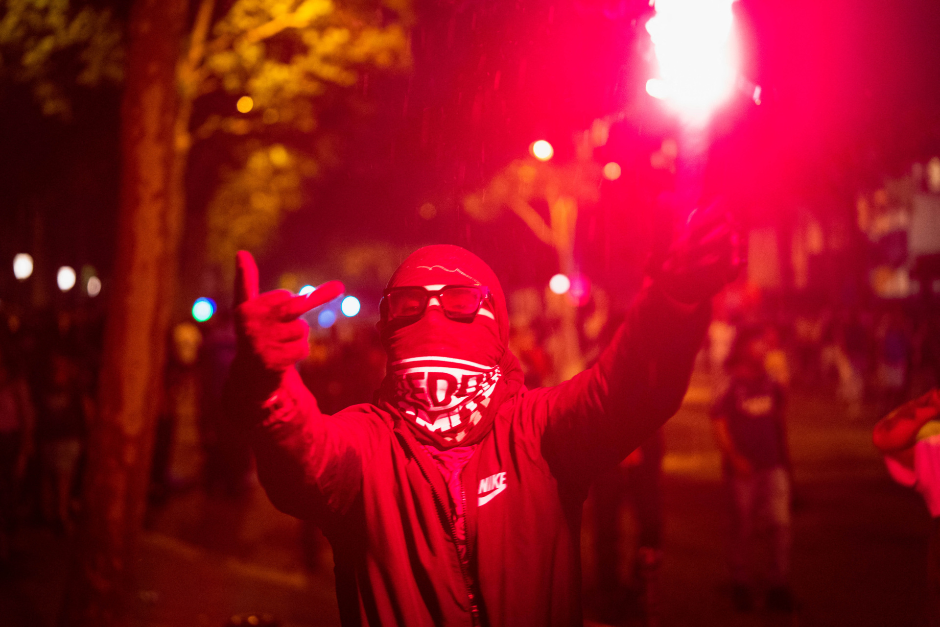 gettyimages-2217368027 Paris Saint-Germain (PSG) supporters gather holding flares in Paris early June 1, 2025, during celebrations following their 5-0 victory in the UEFA Champions League final football match against Inter Milan held in Munich. (Photo by Nael Chahine / Middle East Images / Middle East Images via AFP) (Photo by NAEL CHAHINE/Middle East Images/AFP via Getty Images)