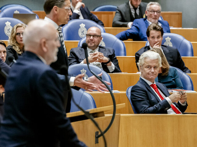NETHERLANDS-GOVERNMENT-POLITICS-PARTIES Dutch far-right leader Geert Wilders (R) attends a debate at the House of Representatives