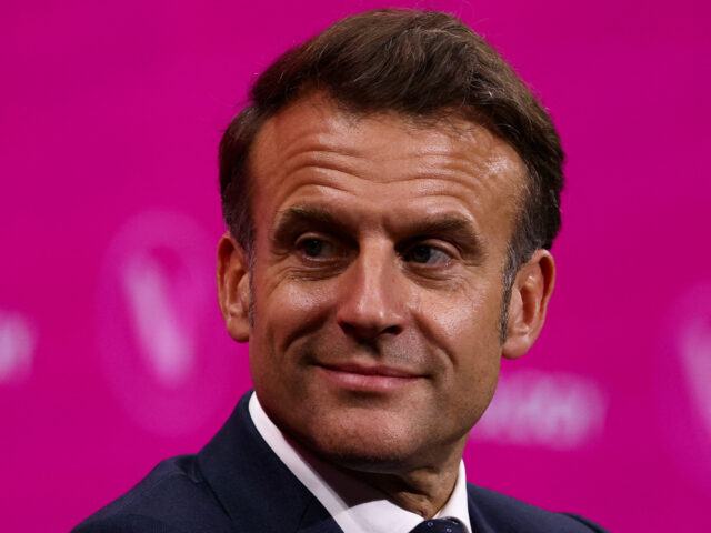 gettyimages-2219057117-1-640x480-1 France's President Emmanuel Macron speaks during a round table discussion as part of his v