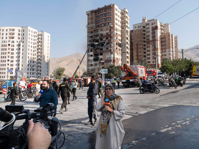 Israeli Attacks On Iran Iranian reporters report from the scene of an explosion at a residential complex due to Is