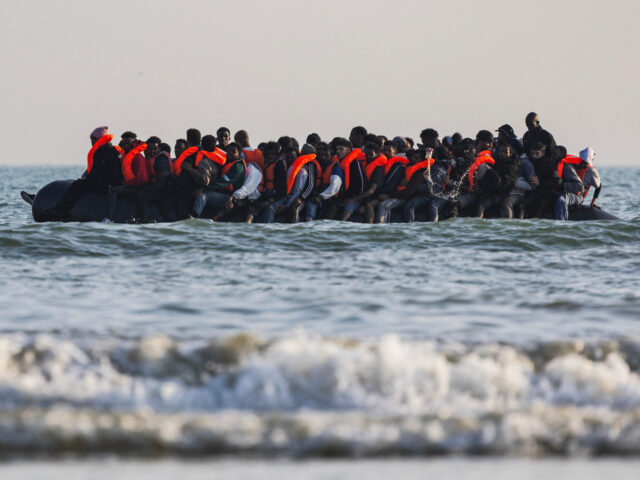 gettyimages-2219230151-1-640x480-1 Migrants aboard a smuggler's boat attempt to cross the English Channel off the beach of Gr