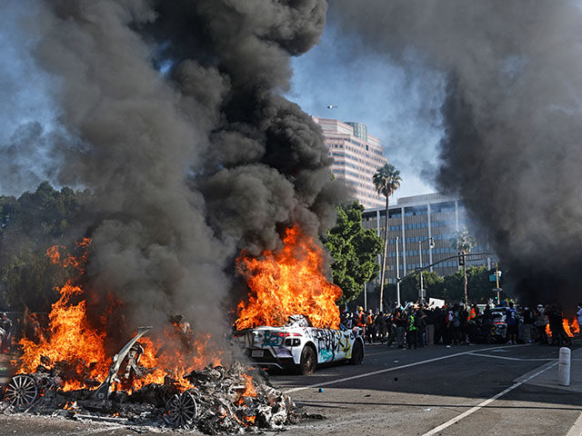 gettyimages-2219268737-640x480-1 Waymo cars burn during immigration raid protests on June 08, 2025 in Los Angeles, Californ