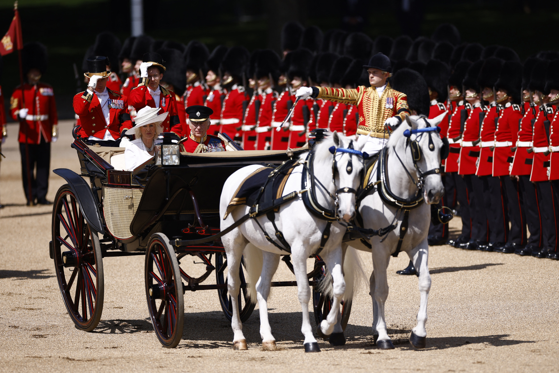 gettyimages-2219374440 Britain's King Charles III and Britain's Queen Camilla arrive to Horse Guards Parade during the King's Birthday Parade, "Trooping the Colour", in London on June 14, 2025. The ceremony of Trooping the Colour is believed to have first been performed during the reign of King Charles II. Since 1748, the Trooping of the Colour has marked the official birthday of the British Sovereign. Over 1500 parading soldiers and almost 300 horses take part in the event. (Photo by BENJAMIN CREMEL / AFP) (Photo by BENJAMIN CREMEL/AFP via Getty Images)