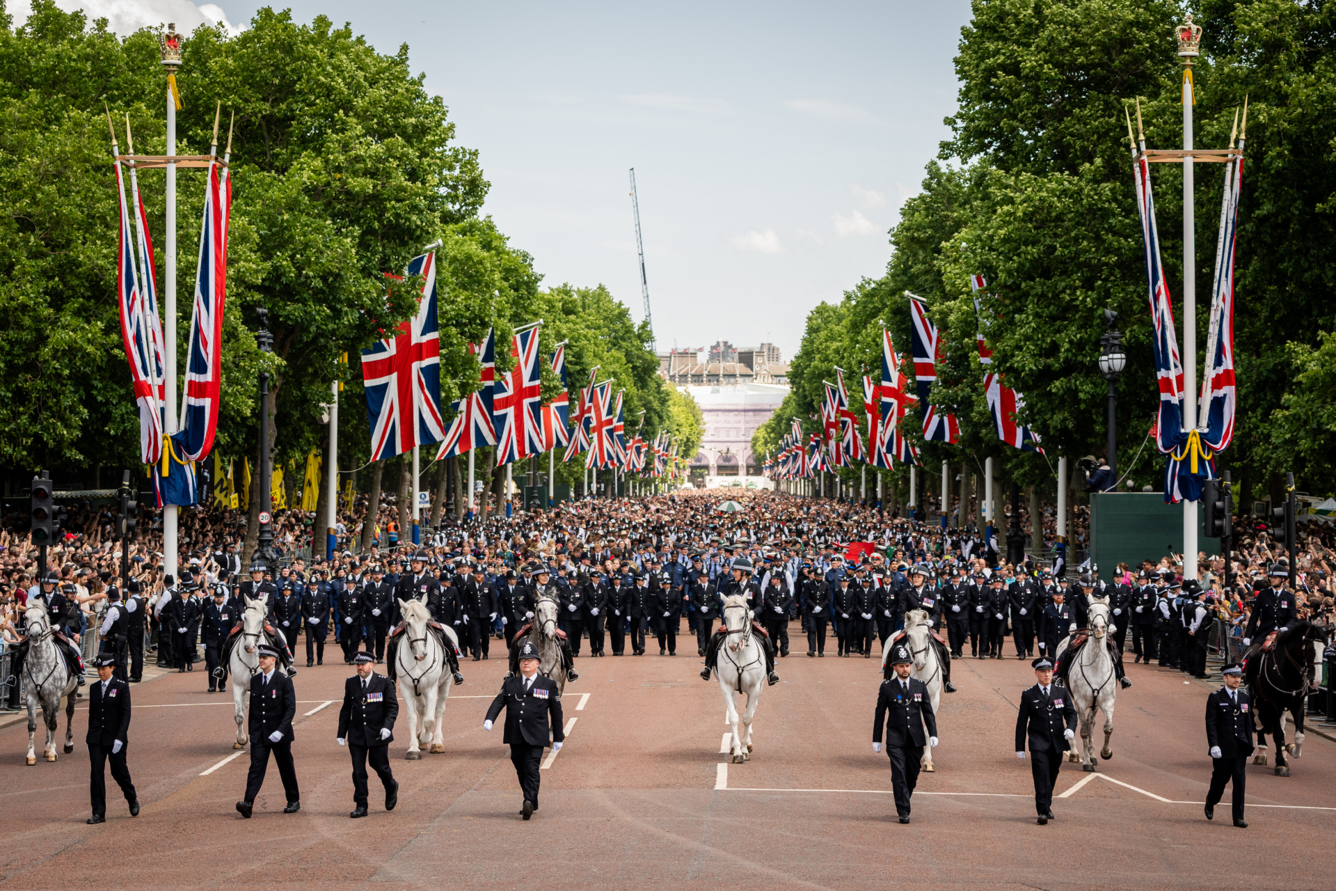gettyimages-2219378966 Members of the public line up on the Mall, London, to view the flypast following, the Trooping the Colour ceremony in central London, as King Charles III celebrates his official birthday. Picture date: Saturday June 14, 2025. (Photo by Aaron Chown/PA Images via Getty Images)