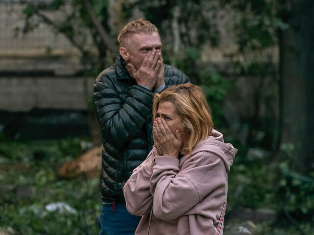 Russian Ballistic Missile Hit A Residential Apartment Building In Kyiv Family members of those still missing under the debris are at the site of a residential bu