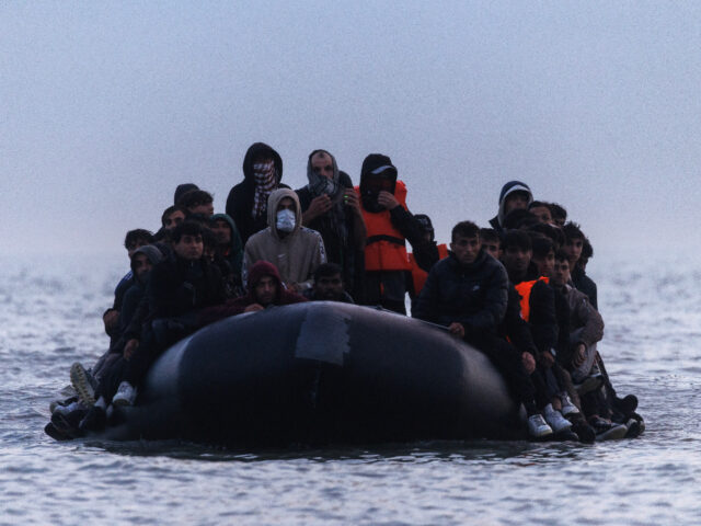 gettyimages-2219905523-1-640x480-1 GRAVELINES, FRANCE - JUNE 13: Migrants make their way from the shore in a small boat on Ju