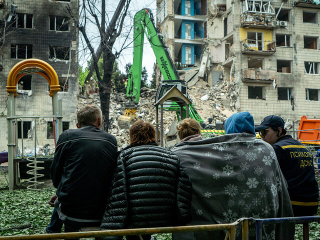 Deadly Drone-And-Missile Strike On Ukraine's Capital KYIV, UKRAINE - JUNE 17: A psychologist of State Emergency Service provides aid to people