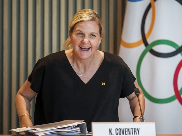 GettyImages-2221332989 President of the International Olympic Committee Kirsty Coventry smiles seating or her fir