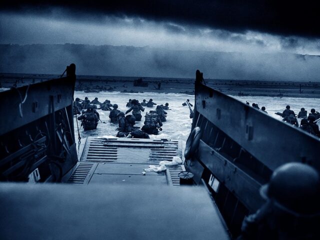 US Troops rushing to the Normandy Beaches. Photograph of US Troops rushing to the Normandy Beaches in France during the D-Day landing