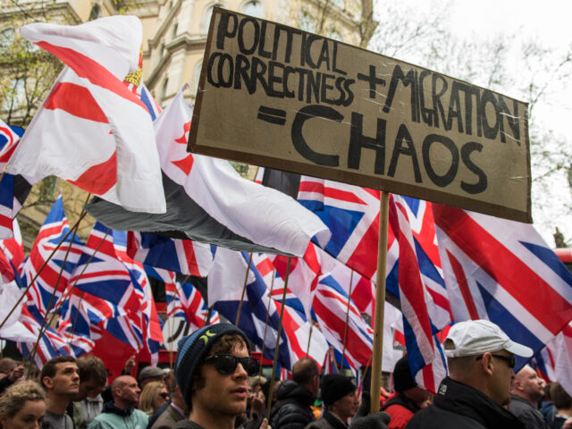 gettyimages-662960470-1-640x480-1 LONDON, ENGLAND - APRIL 01: Protesters hold placards and British Union Jack flags during a