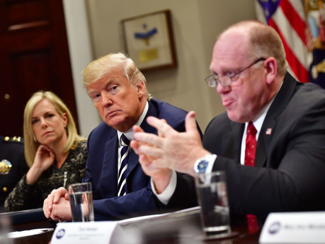 GettyImages-935194598 WASHINGTON, DC - MARCH 20: President Donald Trump (C) holds a law enforcement roundtable o