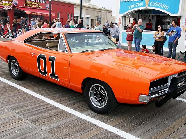 gettyimages1251864771-640x480-1 The "Dukes of Hazzard" car "The General Lee" is chased down the boardwalk by the Sheriff d