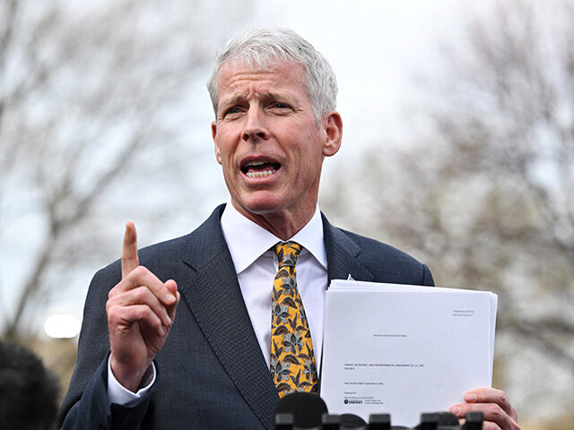 gettyimages2205308123-640x480-1 Energy Secretary Chris Wright holds a copy of "Energy, Economic, and Environmental Assessm