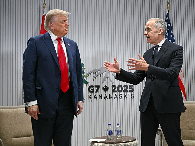 gettyimages2219723749-640x480-1 US President Donald Trump looks on as Canadian Prime Minister Mark Carney (R) speaks as th