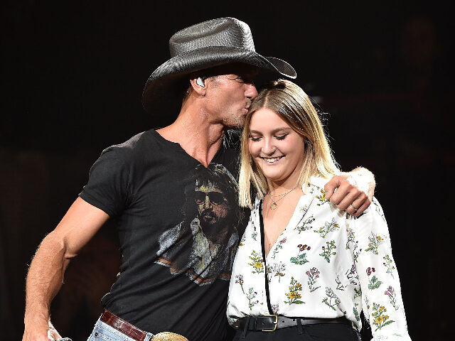 GracieMcGraw NASHVILLE, TN - AUGUST 15: Musician Tim McGraw, left, performs with his daughter Gracie M