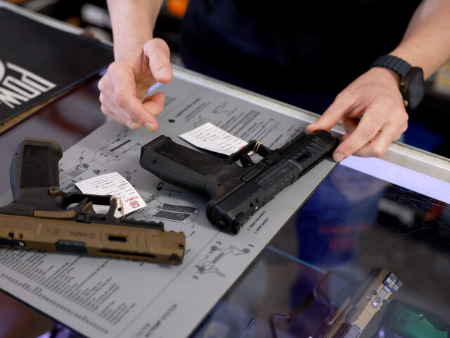handgun purchase Brandon Wexler helps a customer shop for a handgun at his WEX Gunworks store on January 31