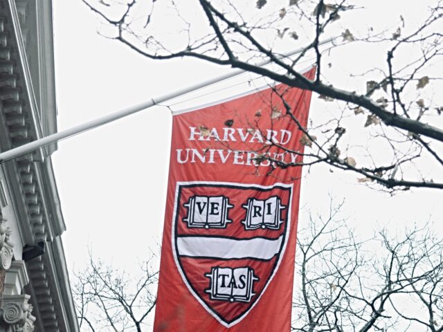 harvard university flag Trump Blocks New Foreign Student Visas for Harvard U.