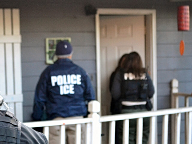 ICE agents at door of home In this Feb. 9, 2017, photo provided U.S. Immigration and Customs Enforcement, ICE agents