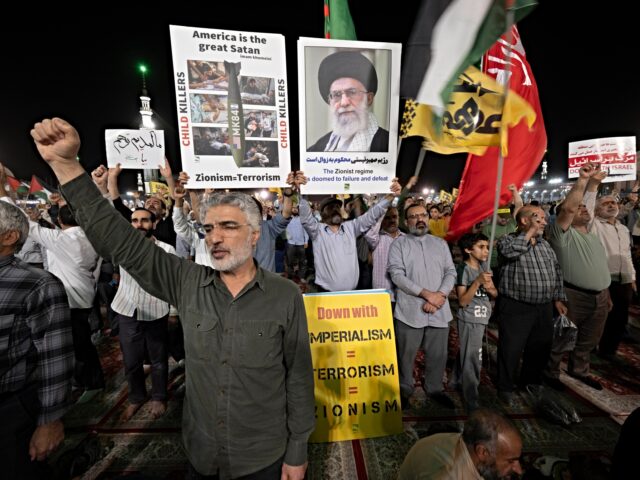 iran and israel fight on Iranian protesters shout anti-U.S. and anti-Israeli slogans while some of them hold placar