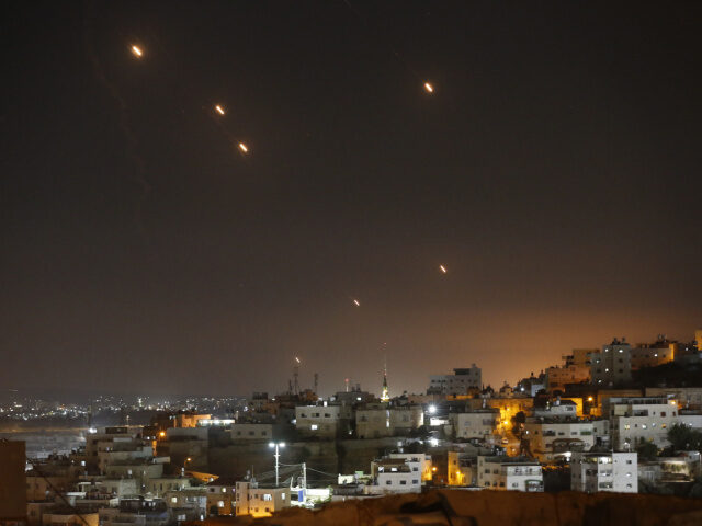 Iran Launches Missiles at Israel Many rockets, fired from Iran, are seen over Jerusalem from Hebron, West Bank on October 0