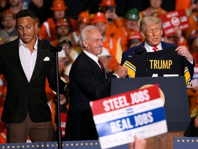 Jeff Swensen_Getty Images (2) WEST MIFFLIN, PENNSYLVANIA - MAY 30: President Donald Trump receives a Pittsburgh Steeler