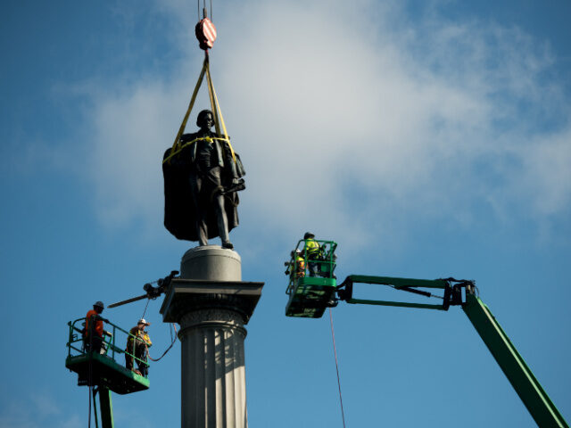 John C. Calhoun Statue Removal CHARLESTON, SC - JUNE 24: Workers use cherry pickers to help remove the John C. Calhoun st